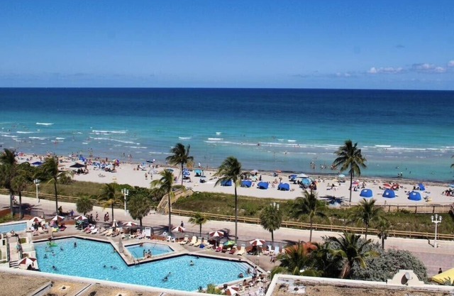 Hollywood Beach Resort condo with heated pool, gym, and beach access