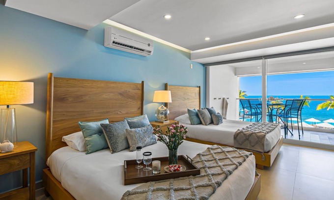Las Glorias Apartment | Gorgeous 1BR Condo with Pools & Sea Views