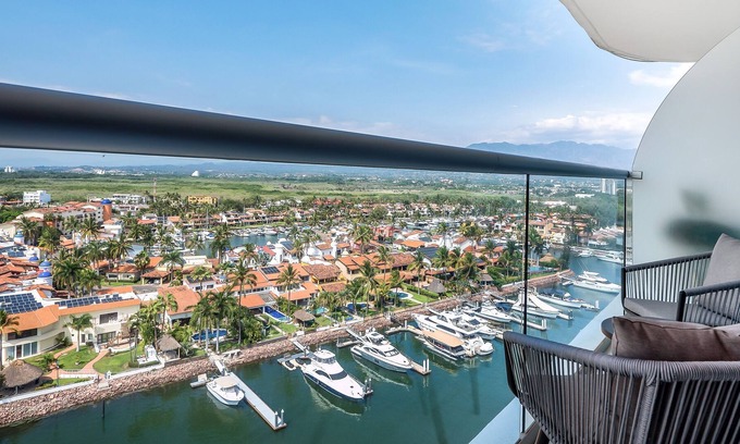 Isla Iguana Apartment | Modern, water & mountain view condo with huge balcony, rooftop pool, gym, & spa