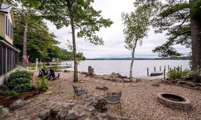 Melvin Village House | Timeless lakefront home on Lake Winnipesaukee with screened-in porch and dock