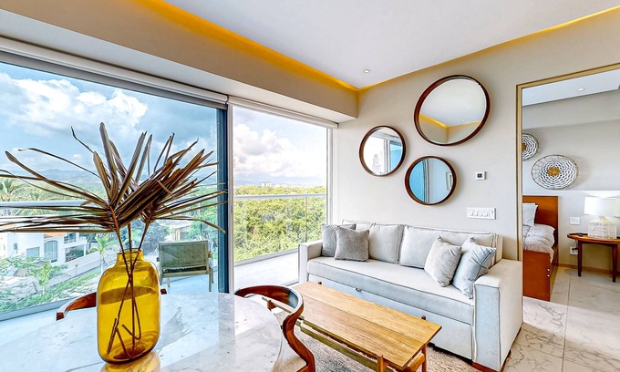Flamingos Condo | Updated condo with sweeping views, pools, fitness room, balcony, W/D, and AC