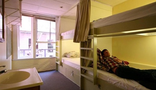 1 bed in 10 bed co-ed dorm room with shared bathroom